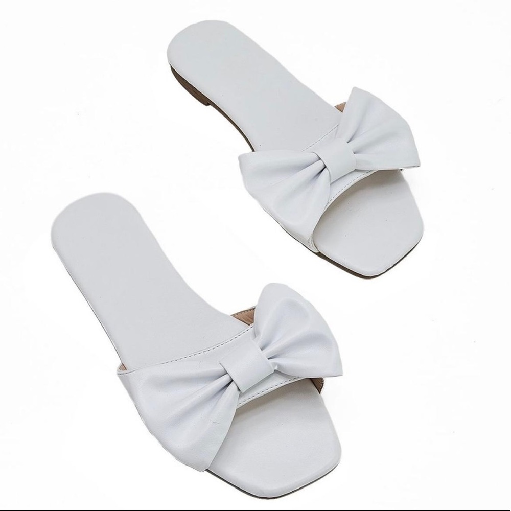 Fancy Bow tie Slippers PU Leather base. These are New And never won